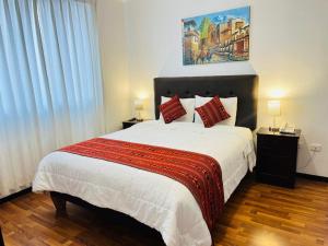 Cama ou camas em um quarto em Hotel Santa Maria