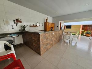 Køkken eller tekøkken på Acomodação Ji-Paraná próximo a Havan