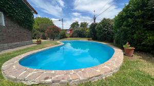 a swimming pool in the yard of a house at Casita de Capilla como Hotel in Capilla del Señor