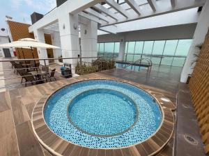 a large swimming pool on the top of a cruise ship at Gallery Suite en Riverfront Puerto Santa Ana in Guayaquil +38 photos