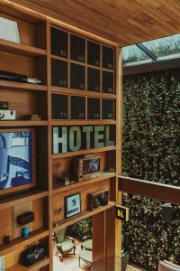 a room with a hotel sign on a wall at The Click Clack Hotel Bogotá in Bogotá