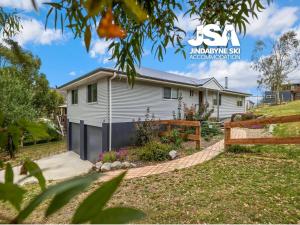 a house with a fence in front of it at Banksia 15 in Kalkite