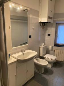 a bathroom with a sink and a toilet at Martel Rooms - Genova Centro Brignole in Genoa +83 photos