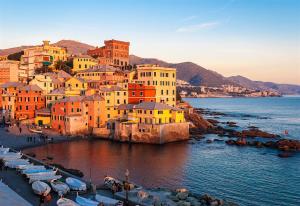 a group of buildings with boats in the water at Martel Rooms - Genova Centro Brignole in Genoa