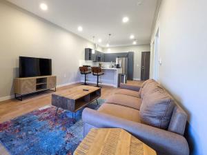 a living room with a couch and a table at 324 Brand New 1 Bedroom 1 Bath 1 Kitchen 1 Liv in Dunellen