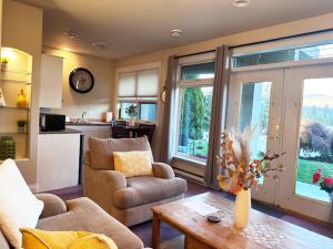 a living room with a couch and a table at Quail Ridge in Kelowna