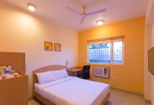 Кровать или кровати в номере Ginger Pune - Pimpri