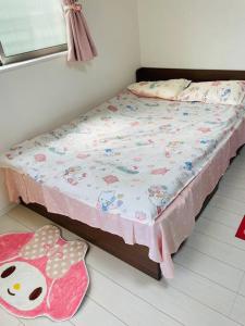 Postel nebo postele na pokoji v ubytování 糖果屋 岸里玉出