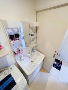 Postel nebo postele na pokoji v ubytování 糖果屋 岸里玉出