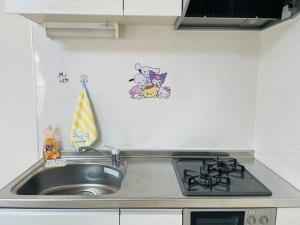 Kuchyň nebo kuchyňský kout v ubytování 糖果屋 岸里玉出