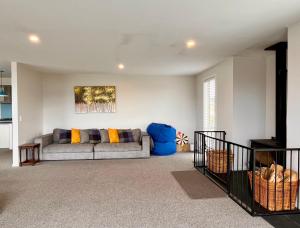 a living room with a couch in a room at Blae Loch - Lake Tekapo in Lake Tekapo