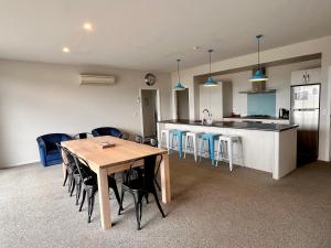 a kitchen and dining room with a table and chairs at Blae Loch - Lake Tekapo in Lake Tekapo