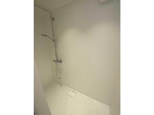 a bathroom with a shower in a white wall at Starry sky Comfortable holiday residence in Huf +32 photos