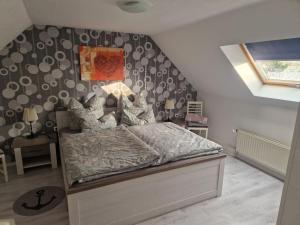 a bedroom with a large bed in a room at Country House East Frisia in Großheide
