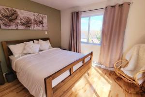 Un ou plusieurs lits dans un hébergement de l'établissement Chalet Ô Lac-Brome, 3ch, 8 personnes