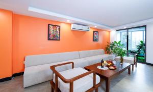 a living room with a couch and a table at Hai Yen Apartment in Sa Pa