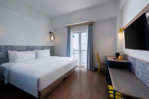 Postel nebo postele na pokoji v ubytování Kampi Hotel Legian + 18 fotografií