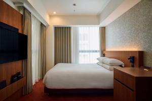 Postel nebo postele na pokoji v ubytování Hotel Grand Bach Kyoto Select