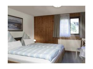 a bedroom with a large bed and a window at Irene Dorn Comfortable holiday residence in Erling
