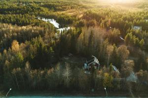 an aerial view of a house in a forest at Perinteinen mökki, walking distance from centre in Kittilä