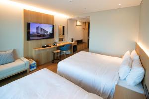 Postel nebo postele na pokoji v ubytování Haenam 126 Hotel + 37 fotografií