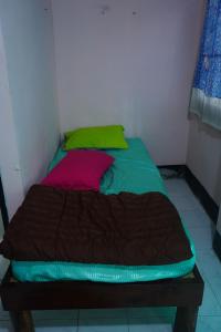 Postel nebo postele na pokoji v ubytování Paifah Hostel