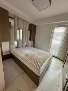 Ένα ή περισσότερα κρεβάτια σε δωμάτιο στο Luxury Apartments Peshtani