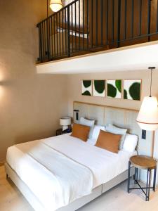 Postel nebo postele na pokoji v ubytování Tradere Hotel Boutique