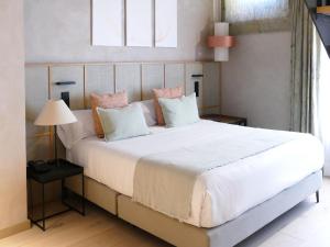 Postel nebo postele na pokoji v ubytování Tradere Hotel Boutique