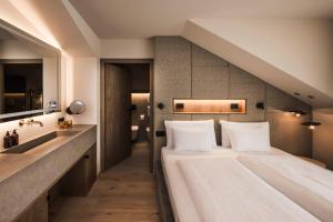 Voodi või voodid majutusasutuse Excelsior Dolomites Life Resort toas