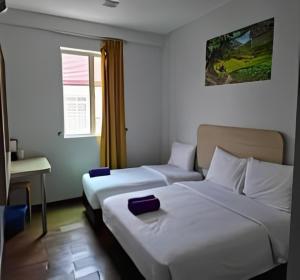 Postel nebo postele na pokoji v ubytování Santai Morib Hotel