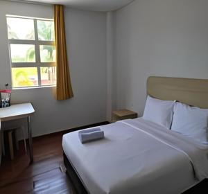 Postel nebo postele na pokoji v ubytování Santai Morib Hotel