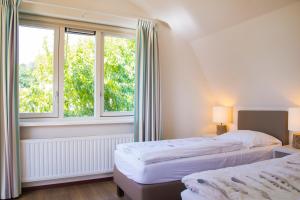 Vakantiepark Duinrust客房内的一张或多张床位