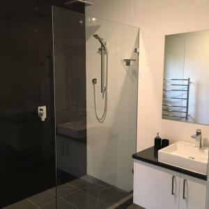 a bathroom with a shower and a sink at Watsons in Merrijig