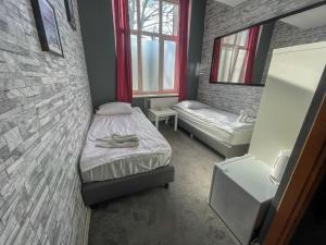 Postel nebo postele na pokoji v ubytování Central Sopot
