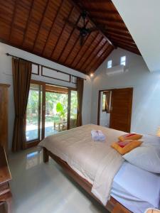 Postel nebo postele na pokoji v ubytování Bali Asli Guest House by EPS + 37 fotografií