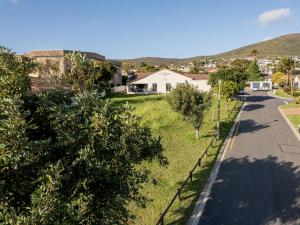 a street in a residential neighborhood with trees at Cape Panorama Lodge in Panorama