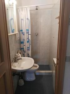 a bathroom with a sink and a toilet and a shower at Appartamenti in Villa e Casali a Giannella in Santa Liberata