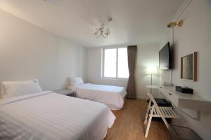 Postel nebo postele na pokoji v ubytování Hillside Hotel