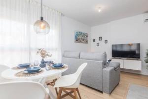 a living room with a couch and a table at Brisas in El Altet