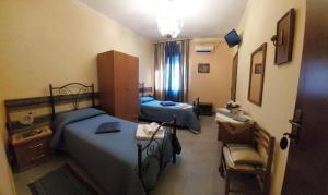 Postel nebo postele na pokoji v ubytování B&B Armonia