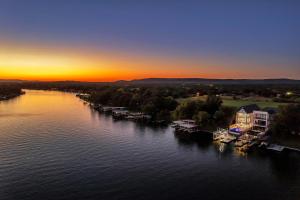an aerial view of a river at sunset at Ellen Lake Luxe with Concierge Services in Kingsland