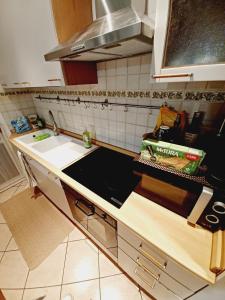 Kuchyň nebo kuchyňský kout v ubytování Casa di Minù