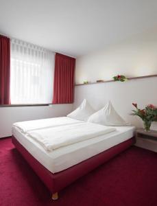 Postel nebo postele na pokoji v ubytování Central Hotel Garni