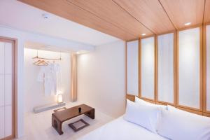 Postel nebo postele na pokoji v ubytování Hotel Yusurim