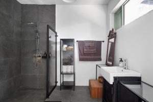 a bathroom with a shower and a sink at Casa Algarrobo relaxing farm stay in Puerto Rico in Cerro Gordo +68 photos