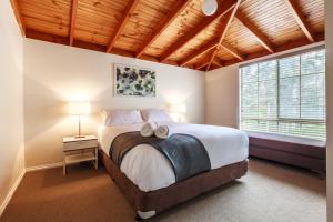 Posteľ alebo postele v izbe v ubytovaní The Cottages at Hepburn Springs