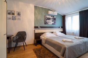 Postel nebo postele na pokoji v ubytování A16 Design Panzió
