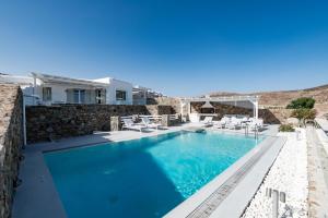 a villa with a swimming pool and a resort at Villa Alice in Elia Beach
