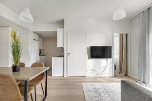 Et tv og/eller underholdning på Kotimaailma Apartments Pukkila III